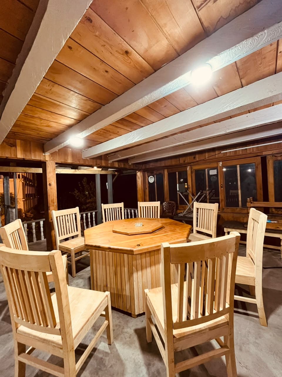 Dining hall with a timber ceiling and wooden furniture