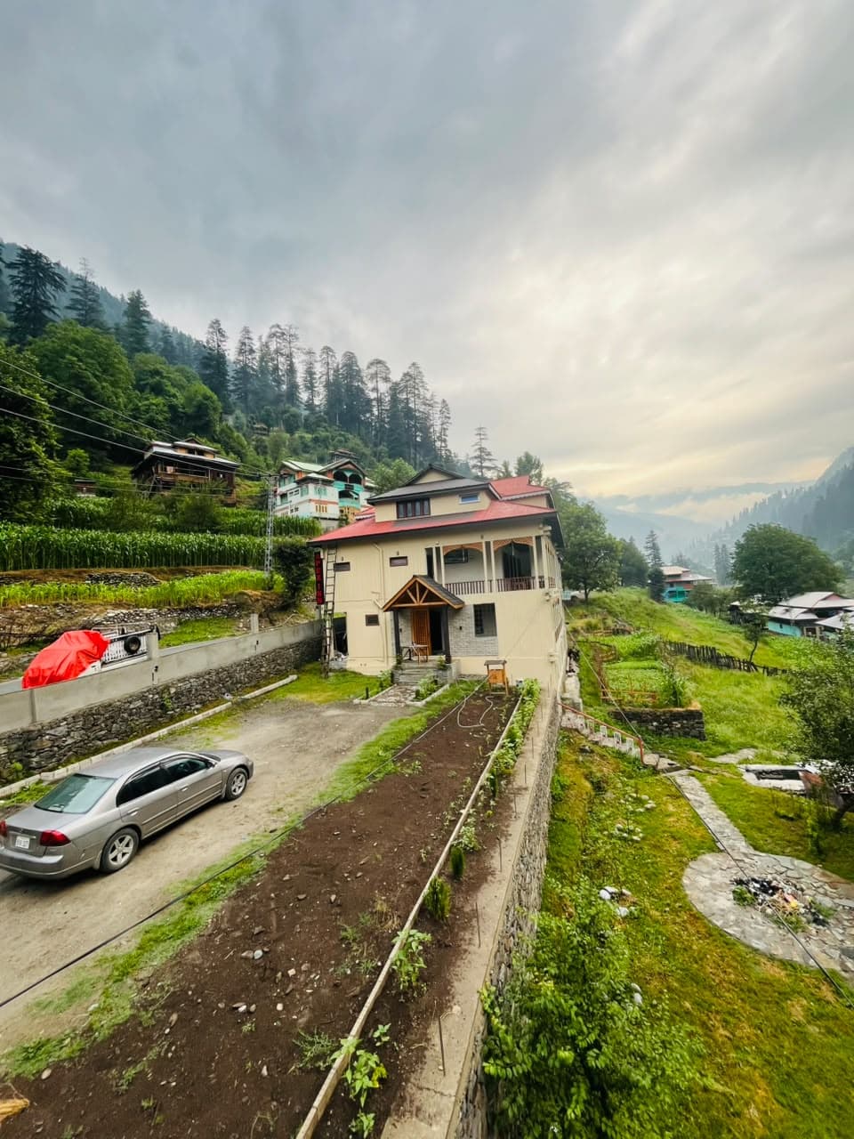 Apex Inn above its driveway and gardens, looking down Neelum Valley