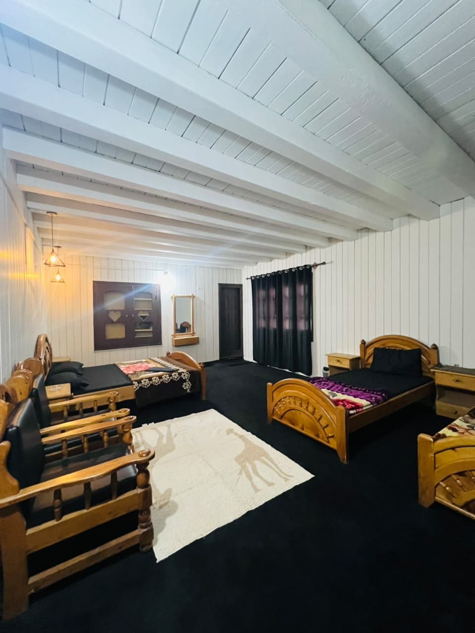 Family room seating area beside the beds