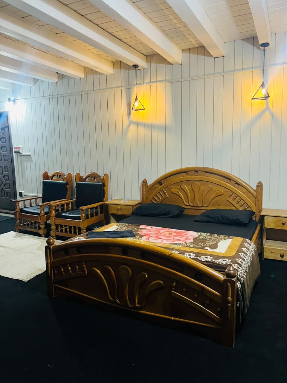 Family room double bed with armchairs