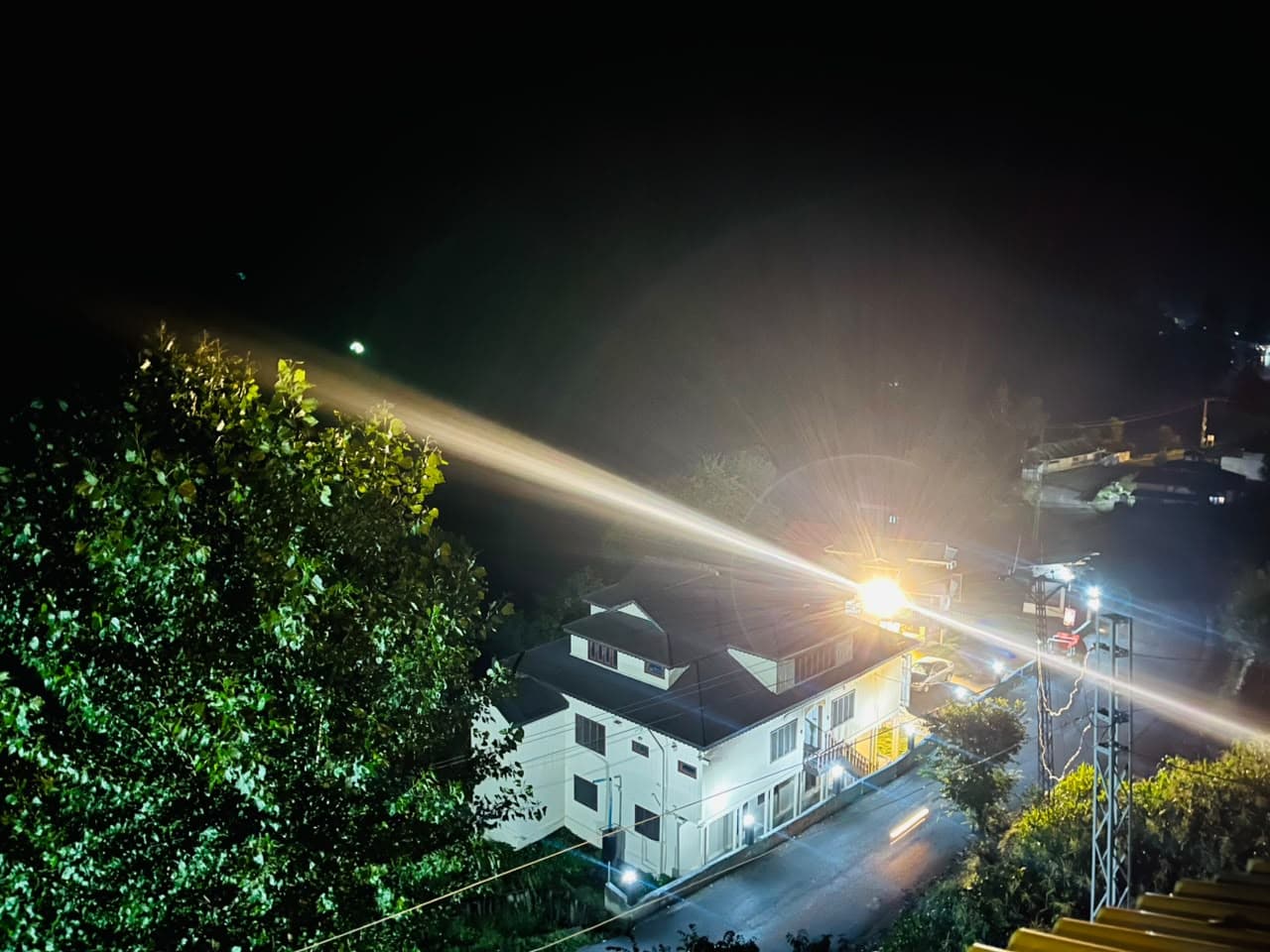 Night view over the valley road and nearby buildings
