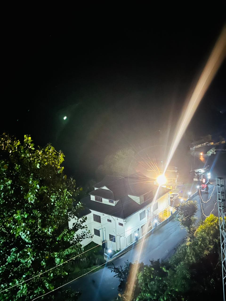 Night view down to the valley road from Apex Inn